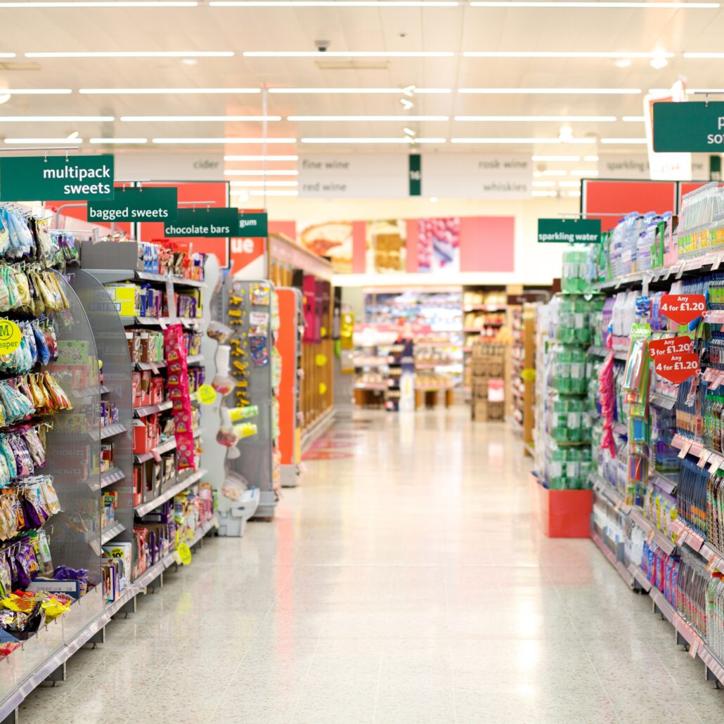 Supermarket aisle filled with a collection of groceries