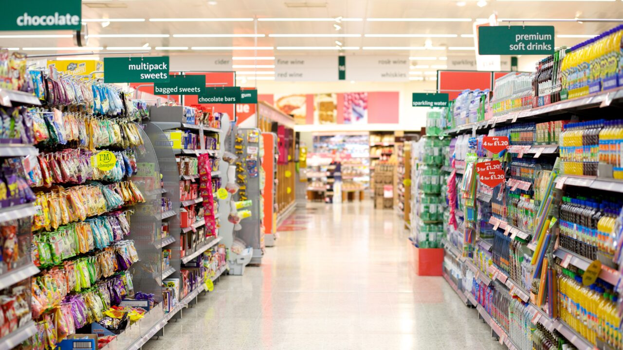 Supermarket aisle filled with a collection of groceries